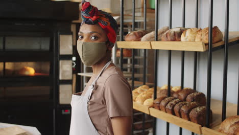 Portrait-of-Black-Woman-in-Mask-at-Work-in-Bakery